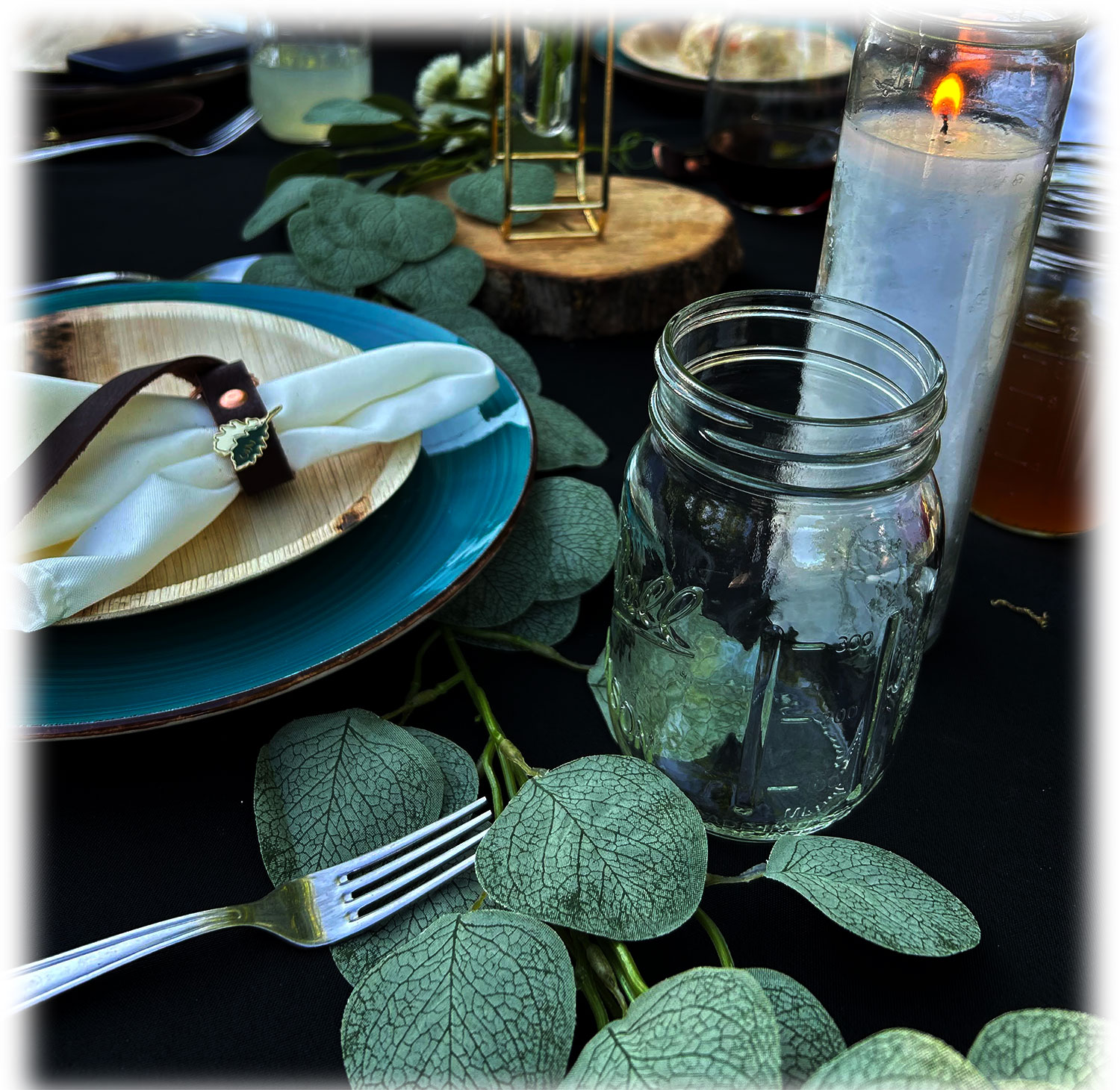A set table: oak napkin ring, mason jar, candle